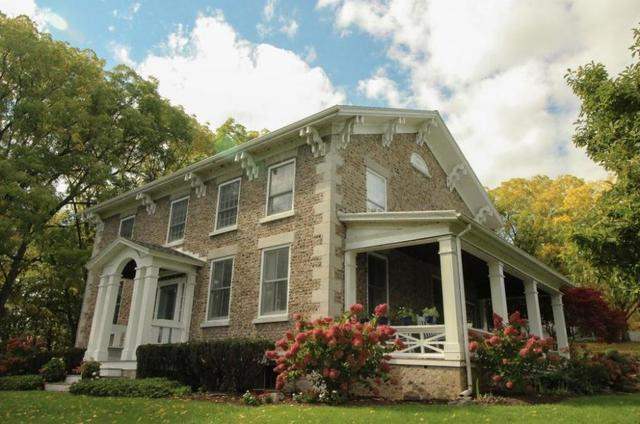 Home with brick exterior and porch